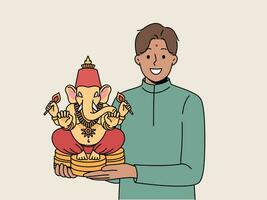 Indian man holds figurine Lord ganesha and smiles demonstrating amulet that brings good luck vector