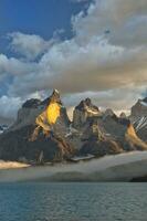 Sunrise over Cuernos del Paine, Torres del Paine National Park and Lake Pehoe, Chilean Patagonia, Chile photo