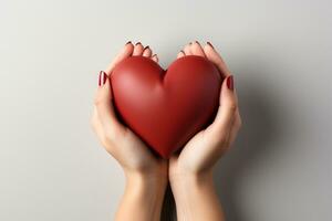 AI generated hands holding a red heart. valentine's day concept in front of white background photo