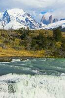 Cascade, Cuernos del Paine behind, Torres del Paine National Park, Chilean Patagonia, Chile photo