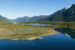 Castillo mountain range and Ibanez river wide valley viewed from the Pan-American Highway, Aysen Region, Patagonia, Chile photo