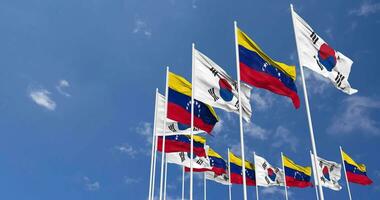 Bolivarian Republic of Venezuela and South Korea Flags Waving Together in the Sky, Seamless Loop in Wind, Space on Left Side for Design or Information, 3D Rendering video