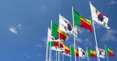 Benin and South Korea Flags Waving Together in the Sky, Seamless Loop in Wind, Space on Left Side for Design or Information, 3D Rendering video