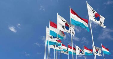 Luxembourg and South Korea Flags Waving Together in the Sky, Seamless Loop in Wind, Space on Left Side for Design or Information, 3D Rendering video