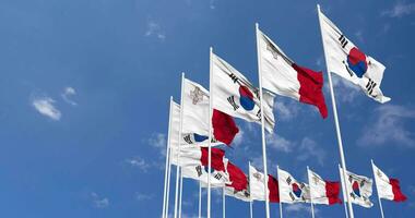 Malta and South Korea Flags Waving Together in the Sky, Seamless Loop in Wind, Space on Left Side for Design or Information, 3D Rendering video