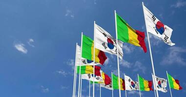 Mali and South Korea Flags Waving Together in the Sky, Seamless Loop in Wind, Space on Left Side for Design or Information, 3D Rendering video