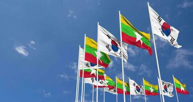 Myanmar, Burma and South Korea Flags Waving Together in the Sky, Seamless Loop in Wind, Space on Left Side for Design or Information, 3D Rendering video