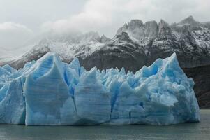Grey Glacier flowing into the lake, Lago Grey, Torres del Paine National Park, Chilean Patagonia, Chile photo