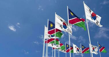 Namibia and South Korea Flags Waving Together in the Sky, Seamless Loop in Wind, Space on Left Side for Design or Information, 3D Rendering video