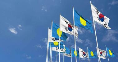 Palau and South Korea Flags Waving Together in the Sky, Seamless Loop in Wind, Space on Left Side for Design or Information, 3D Rendering video