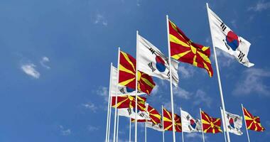 North Macedonia and South Korea Flags Waving Together in the Sky, Seamless Loop in Wind, Space on Left Side for Design or Information, 3D Rendering video