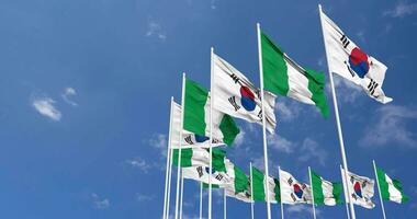 Nigeria and South Korea Flags Waving Together in the Sky, Seamless Loop in Wind, Space on Left Side for Design or Information, 3D Rendering video