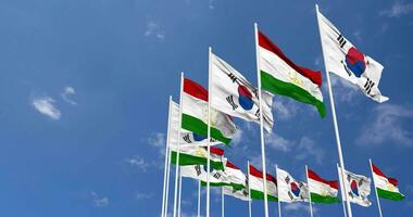 Tajikistan and South Korea Flags Waving Together in the Sky, Seamless Loop in Wind, Space on Left Side for Design or Information, 3D Rendering video