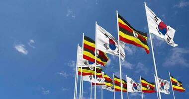 Uganda and South Korea Flags Waving Together in the Sky, Seamless Loop in Wind, Space on Left Side for Design or Information, 3D Rendering video