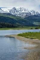 Castillo mountain range and Ibanez river wide valley viewed from the Pan-American Highway, Aysen Region, Patagonia, Chile photo