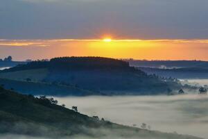 Early morning fog over valleys and mountains, Serra da Canastra, Minas Gerais state, Brazil photo