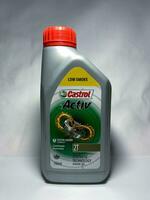 Surakarta, Indonesia, 2023 - Castrol active motor oil for 2 stroke motorcycles, continuous protection synthetic technology engine oil 700ml. Plastic bottle for engine oil. photo