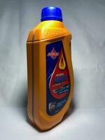 Sidoarjo, Indonesia, 2022 - Federal matic AT 10W-30 API SJ JASO MB 800 ml. Federal Oil. Plastic bottle of federal engine oil. Isolated on white background photo
