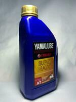 Surakarta, Indonesia, 2023 - Yamaha Yamalube super matic motor oil, full synthetic api service sl for matic motorcycle. Yamaha Yamalube oil. Plastic bottle for engine oil. photo