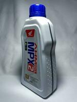 Surakarta, Indonesia, 2023 - MPX 2 AHM matic motor oil, engine protection technology  SL JASO MB for matic motorcycle 800ml. Plastic bottle for engine oil. photo