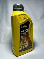 Surakarta, Indonesia, 2023 - Evalube Pro 2T motor oil, synthetic jaso for 2T motorcycle 700ml. Plastic bottle for engine oil. photo