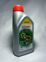Surakarta, Indonesia, 2023 - Castrol active motor oil for 2 stroke motorcycles, continuous protection synthetic technology engine oil 700ml. Plastic bottle for engine oil. photo