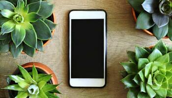 ai generado un célula teléfono Bosquejo en un mesa rodeado por plantas de interior en flor ollas foto