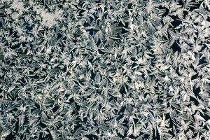 frosty patterns on the window frosty background Ice on a window photo