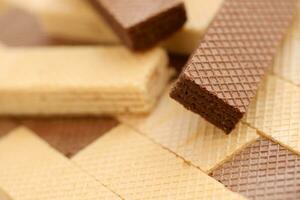 Stacked delicious chocolate wafers in large amount. Two different flavours of classic waffles photo