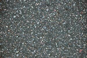 Surface grunge rough of asphalt. Tarmac dark grey grainy road. Texture Background Top view photo