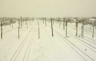 Winter railway landscape, Railway tracks in the snow-covered industrial country photo