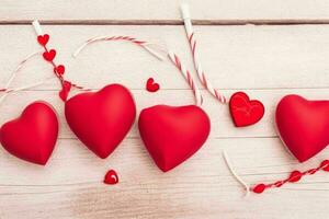 AI generated Wooden background with red heart, candle, gifts. Valentines Day. Mothers Day anniversary. Pro Photo