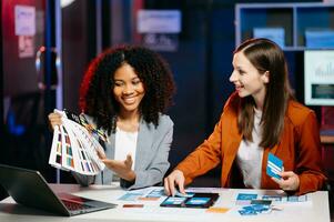 UX developer and ui designer brainstorming about mobile app interface wireframe design with customer breif and color code photo