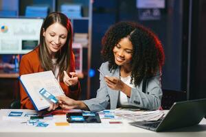 UX developer and ui designer brainstorming about mobile app interface wireframe design with customer breif and color code photo