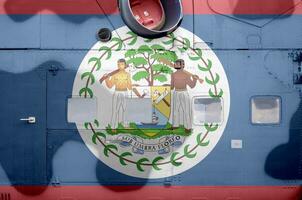 Belize flag depicted on side part of military armored helicopter closeup. Army forces aircraft conceptual background photo