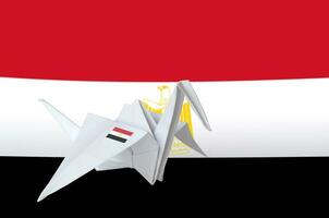 Egypt flag depicted on paper origami crane wing. Handmade arts concept photo