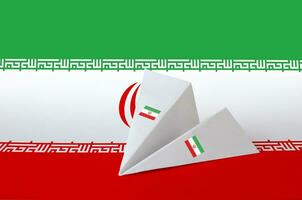 Iran flag depicted on paper origami airplane. Handmade arts concept photo