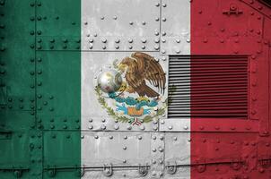 Mexico flag depicted on side part of military armored tank closeup. Army forces conceptual background photo