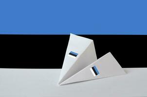 Estonia flag depicted on paper origami airplane. Handmade arts concept photo