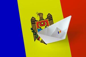 Moldova flag depicted on paper origami ship closeup. Handmade arts concept photo