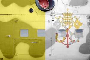 Vatican City State flag depicted on side part of military armored helicopter closeup. Army forces aircraft conceptual background photo