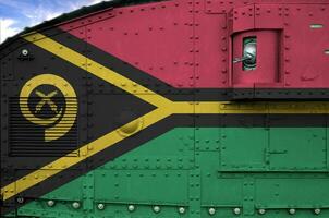 Vanuatu flag depicted on side part of military armored tank closeup. Army forces conceptual background photo