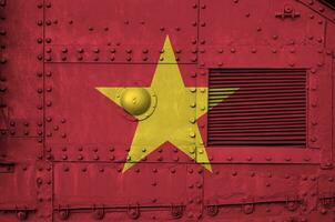 Vietnam flag depicted on side part of military armored tank closeup. Army forces conceptual background photo