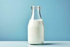 AI generated A glass bottle with full milk on blue background. AI Generated photo