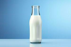 AI generated A glass bottle with full milk on blue background. AI Generated photo