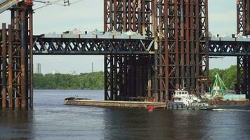Barge Floats Near the Bridge Construction video