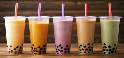 AI generated Plastic cups of different tasty bubble tea on wooden background. Generative AI photo