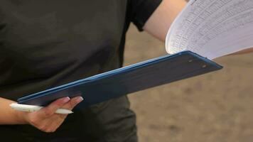 Close-up of clipboard with statistical data., Person Holding Clipboard with Charts video