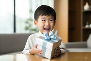 AI generated Cute asian little boy holding a gift box photo