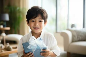 AI generated Cute asian little boy holding a gift box photo